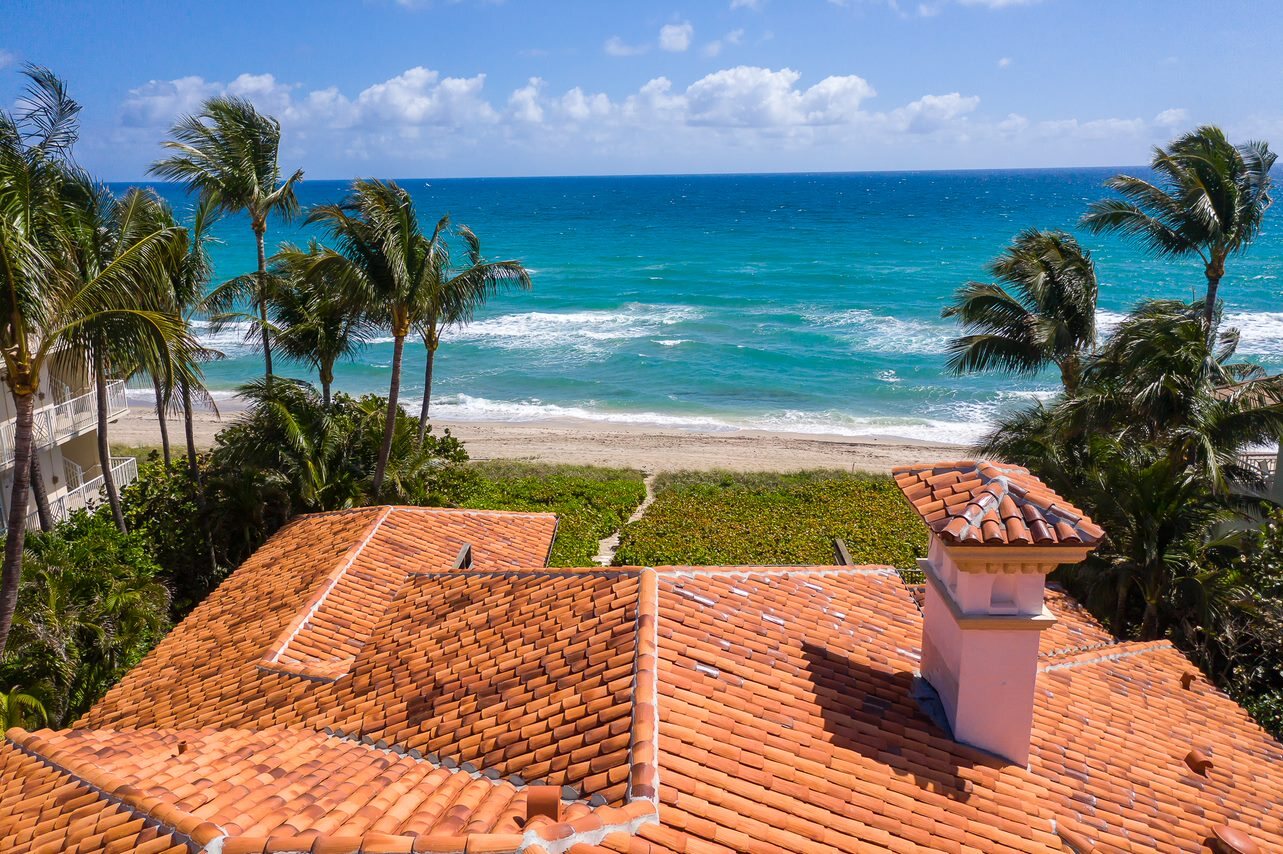 Close aerial view of a completed terracotta tile roof near the South Florida coast.