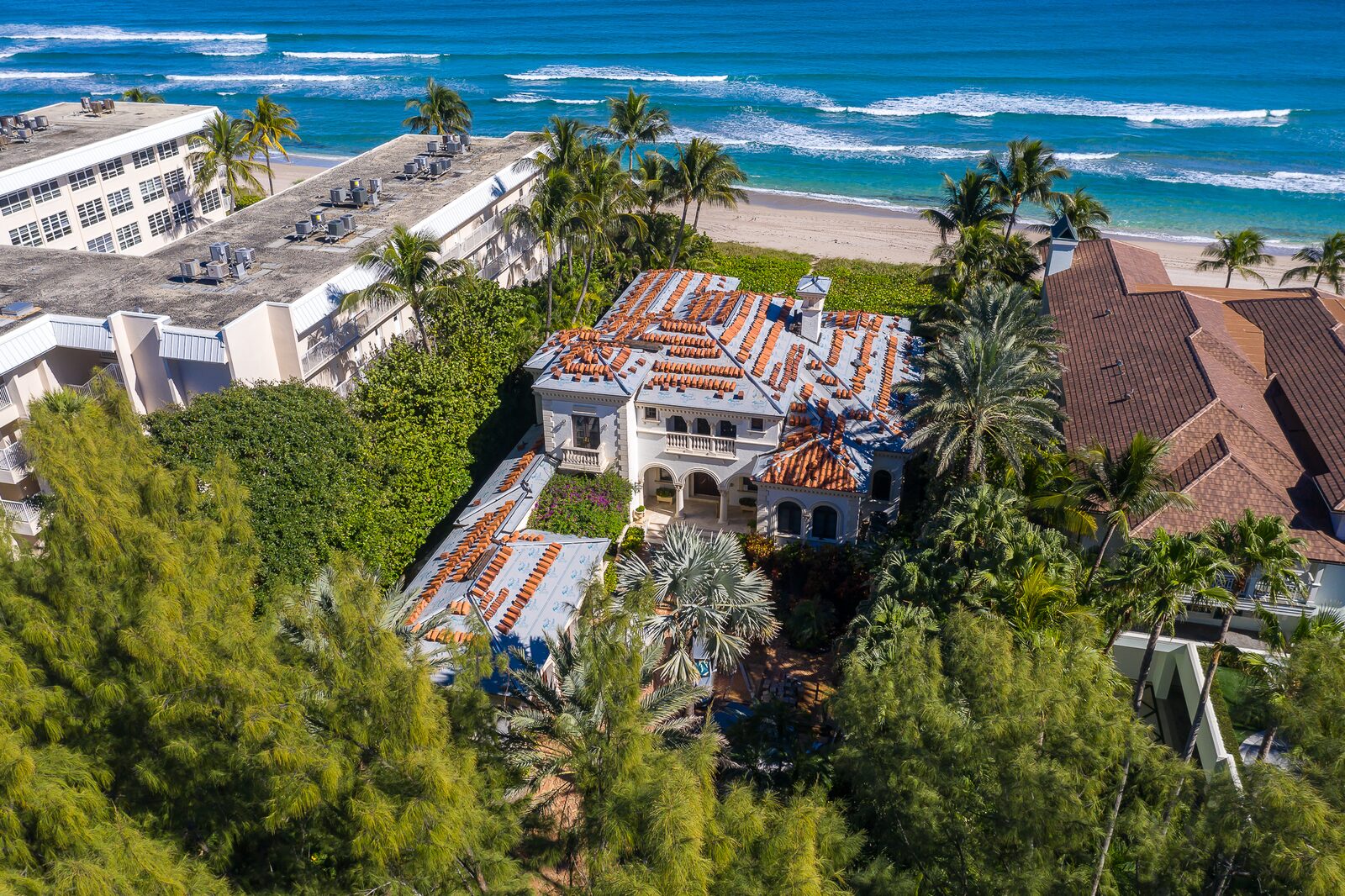Aerial view of tile installation underway on a waterfront home.