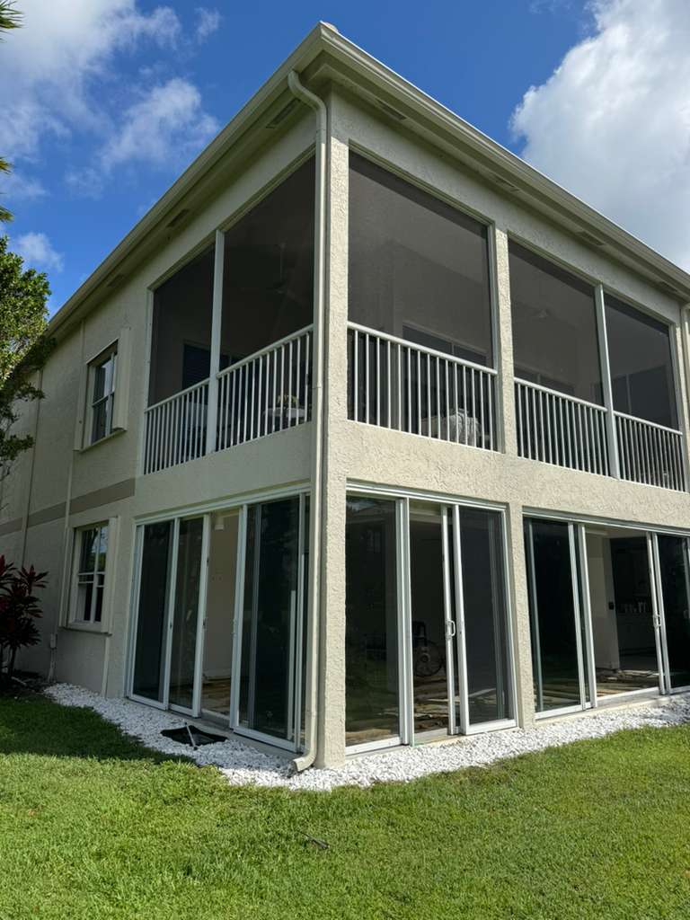 Completed impact windows and sliding glass doors on a South Florida residence.